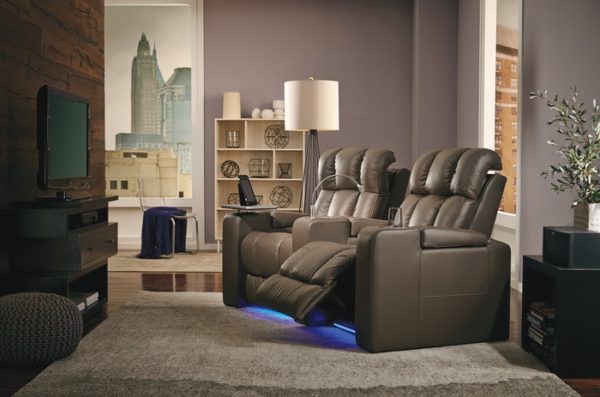 Palliser Ovation style home theater seat shown as set of 2 curved in brown leather with LED in living room setting