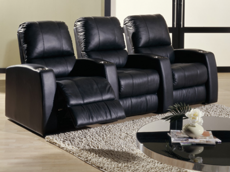 Palliser pacifico 3 seat black leather theater seat group in living room setting one seat open