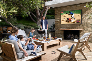 Family enjoying outdoor TV